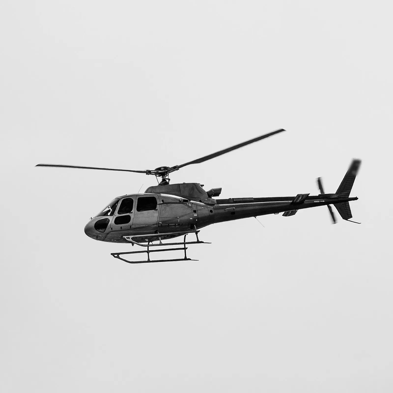 Gray helicopter in flight