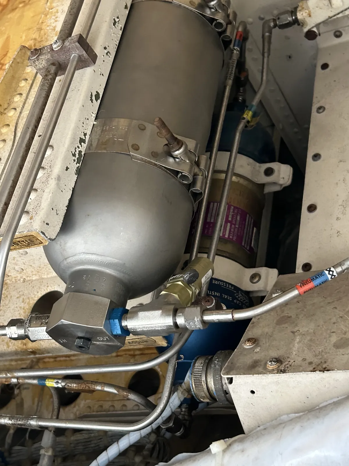 Fire bottle and plumbing in an engine bay